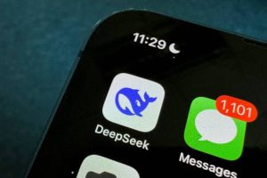 Smartphone screen showing DeepSeek app icon with whale logo, Messages app with 1,101 unread messages, time 11:29 with night mode, indicating AI revolution in chatbot arena