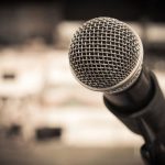 Close-up of a microphone with a blurred background
