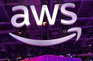 AWS logo with Amazon smile logo underneath on ceiling background