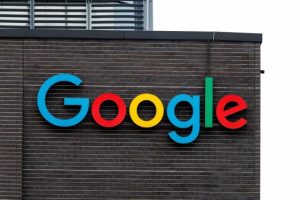 Google logo on a building displaying colorful blue, red, yellow, and green letters