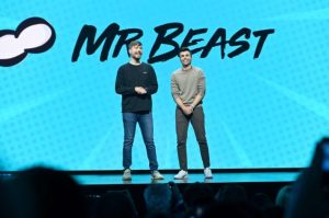 MrBeast Stage with Audience and Cloud-like Graphic