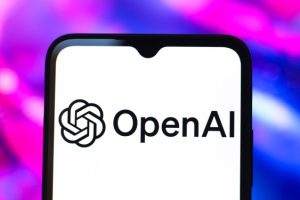OpenAI logo and text on smartphone screen with purple and blue background