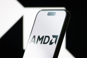 Smartphone displaying AMD logo with a blurred background of the same logo, highlighting AMD's role in AI and silicon photonics innovation