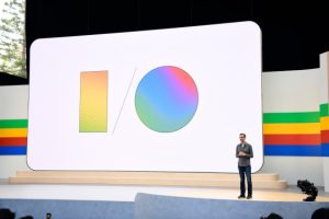 Stage setup at Google I/O 2025 with large screen displaying Google I/O logo and presenter on stage