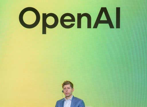 Person standing in front of a large screen displaying the OpenAI logo with a yellow to green gradient background, highlighting the unveiling of O3-PRO AI model.