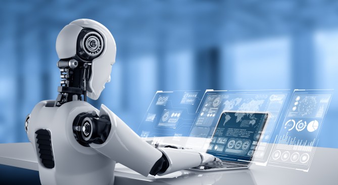Humanoid robot interacting with transparent digital interfaces and working on a laptop in a futuristic, blue-toned environment, showcasing advances in robotics and AI technology.