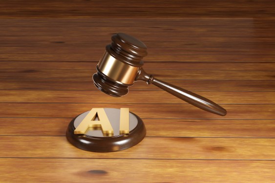 A wooden gavel placed above the letters AI on a wooden surface, symbolizing legal issues related to artificial intelligence and its impact on legal practice.